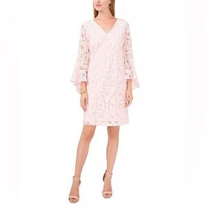Pale pink sheath dress with bell sleeves. Lined body.